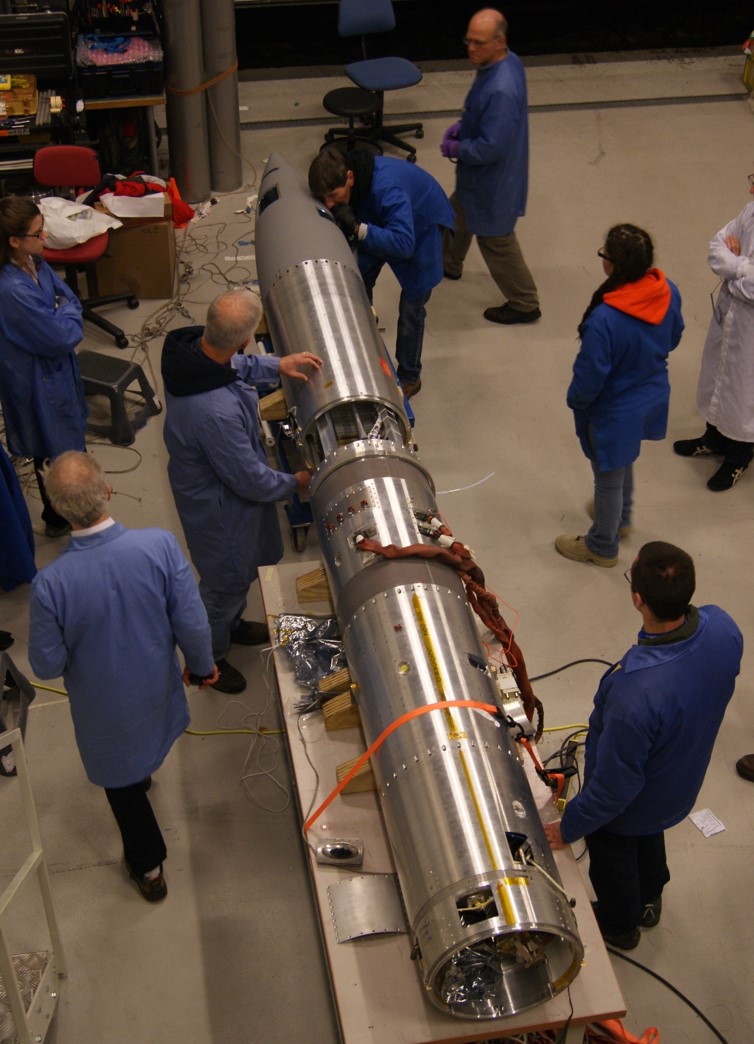 Putting the nosecone on the payload